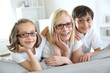 Woman and children with eyeglasses on