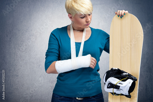 Photo: Unhappy snowboarder with broken arm Unhappy snowboarder with broken arm