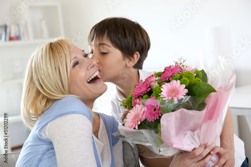 Photo: Young boy celebrating mother's day Young boy celebrating mother's day