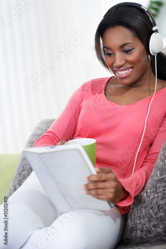 Photo: pretty woman with headphones listening music pretty woman with headphones listening music