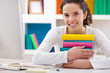 cheerful girl hugging books