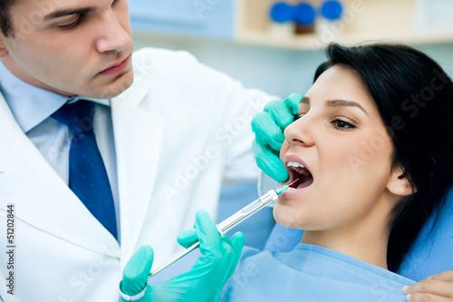 Photo: Dentist anesthetizing patient Dentist anesthetizing patient