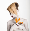Fantasy. Artistry. Woman with Flower. Trendy Coiffure, Bodyart