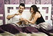 Man addicted to social networking in bed.