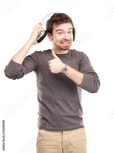 Photo: Attractive young man wearing headphones on white background Attractive young man wearing headphones on white background