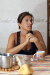 Photo: Woman at her breakfast Woman at her breakfast