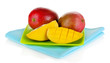 Ripe appetizing mango on green plate isolated on white