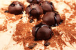 Chocolate candies with cocoa powder, close up