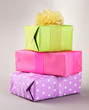 Bright gifts with bows on grey background