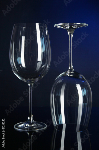 Photo: Two glasses on dark blue background Two glasses on dark blue background