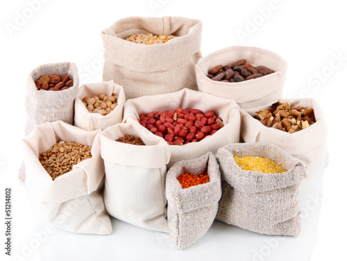 Photo: Different kinds of beans in sacks isolated on white Different kinds of beans in sacks isolated on white