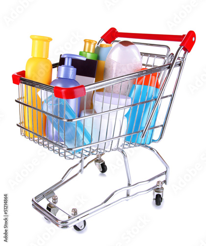 Photo: Cosmetics in cart isolated on white Cosmetics in cart isolated on white