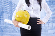 Photo: Close-up safety helmet on blueprint Close-up safety helmet on blueprint