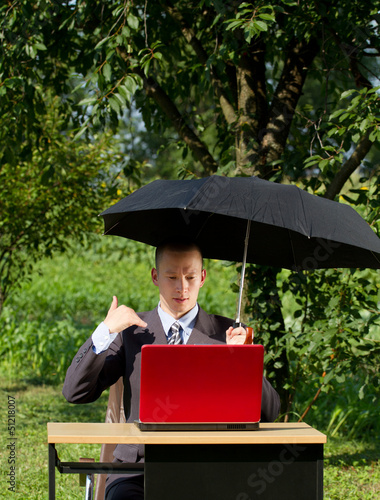 Photo: Businessman Working Outdoors Businessman Working Outdoors