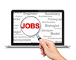 Jobs Search with a magnifying glass on Laptop Computer