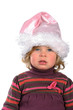 Foto: little girl with Santa Claus- cap little girl with Santa Claus- cap