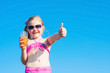 little girl drinks orange juice