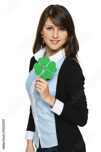 Photo: Young woman holding shamrock leaf Young woman holding shamrock leaf