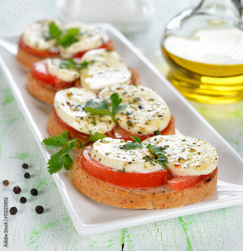 Photo: Bruschetta with tomatoes and mozzarella Bruschetta with tomatoes and mozzarella