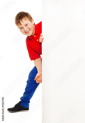 Photo: Cute kid with blank billboard Cute kid with blank billboard