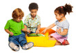 Photo: Two boys and girl playing with tablet Two boys and girl playing with tablet