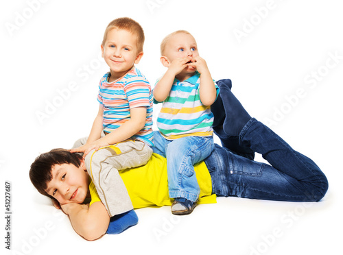 Photo: Two younger brothers ride big one Two younger brothers ride big one