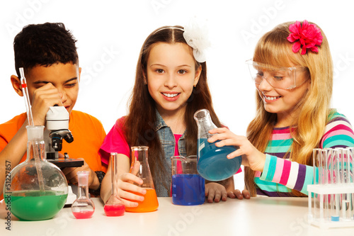 Photo: Three kids and chemistry lesson Three kids and chemistry lesson