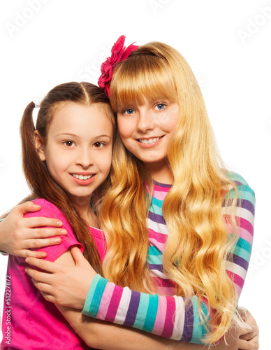 Photo: Two happy girls hugging Two happy girls hugging