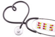 Stethoscope in shape of heart, pills
