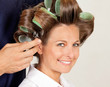 Client With Hairdresser Rolling Her Hair