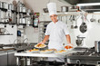 Confident Chef Presenting Pasta Dishes