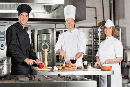 Photo: Chefs Working In Industrial Kitchen Chefs Working In Industrial Kitchen