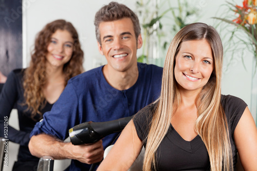 Photo: Happy Team Of Hairstylists At Salon Happy Team Of Hairstylists At Salon