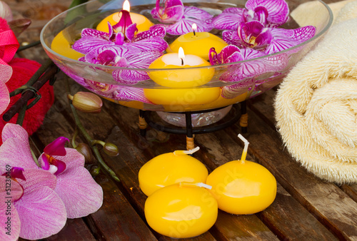 Photo: candles and flowers with towel candles and flowers with towel