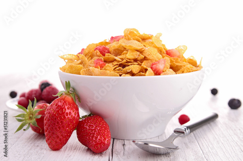 Photo: bowl of cereals and strawberries bowl of cereals and strawberries