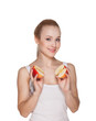 The beautiful girl the blonde holds halves of apples