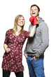 Photo: Young couple fighting with boxing gloves smiling Young couple fighting with boxing gloves smiling