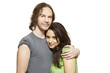 Photo: Young mixed race couple cuddling and smiling Young mixed race couple cuddling and smiling