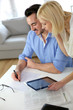 Middle-aged couple working from home