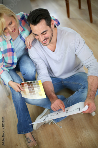 Photo: Couple at home ready to remodel the rooms Couple at home ready to remodel the rooms
