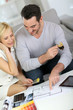 Couple looking at paint colors for new home