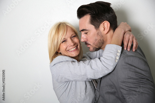 Photo: Trendy loving couple on white background Trendy loving couple on white background