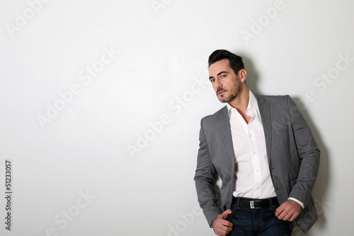 Photo: Middle-aged man standing on white background Middle-aged man standing on white background