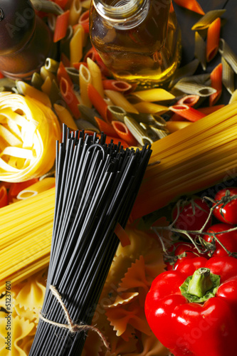Photo: Pasta ingredients on black table Pasta ingredients on black table