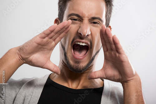 Photo: Young man shouting Young man shouting
