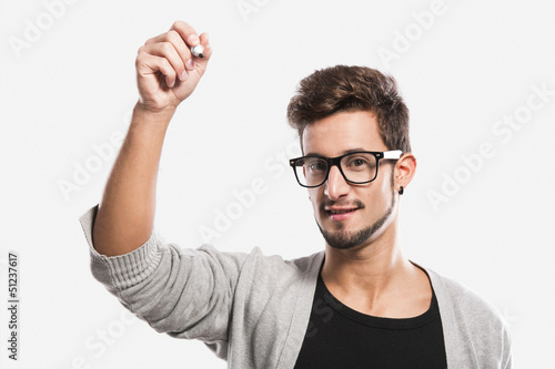 Photo: Young man writing on a glass Young man writing on a glass