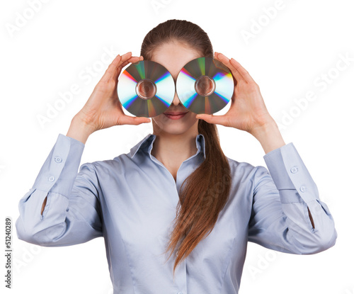 Photo: Woman holds two CDs in front of his face Woman holds two CDs in front of his face