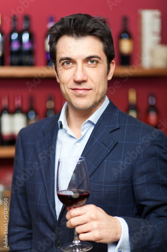 Photo: Sommelier tasting red wine Sommelier tasting red wine