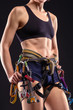 female body in climbing equipment