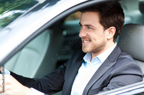 Photo: Handsome man in his new car Handsome man in his new car
